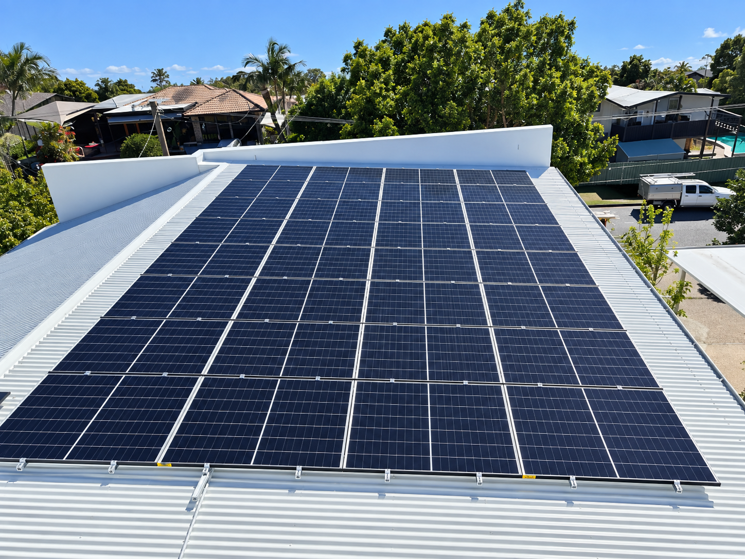 Large rooftop solar panel array installed by CF Energy on a suburban home